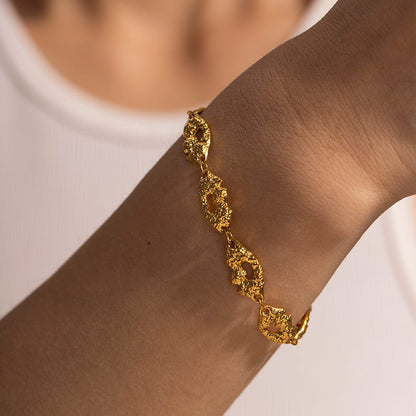 MILA- TEXTURED BRACELET- GOLD. Luxurious Mi Amore gold jewelry, a timeless addition to your collection. Find the finest gold jewelry in Trinidad and Tobago.