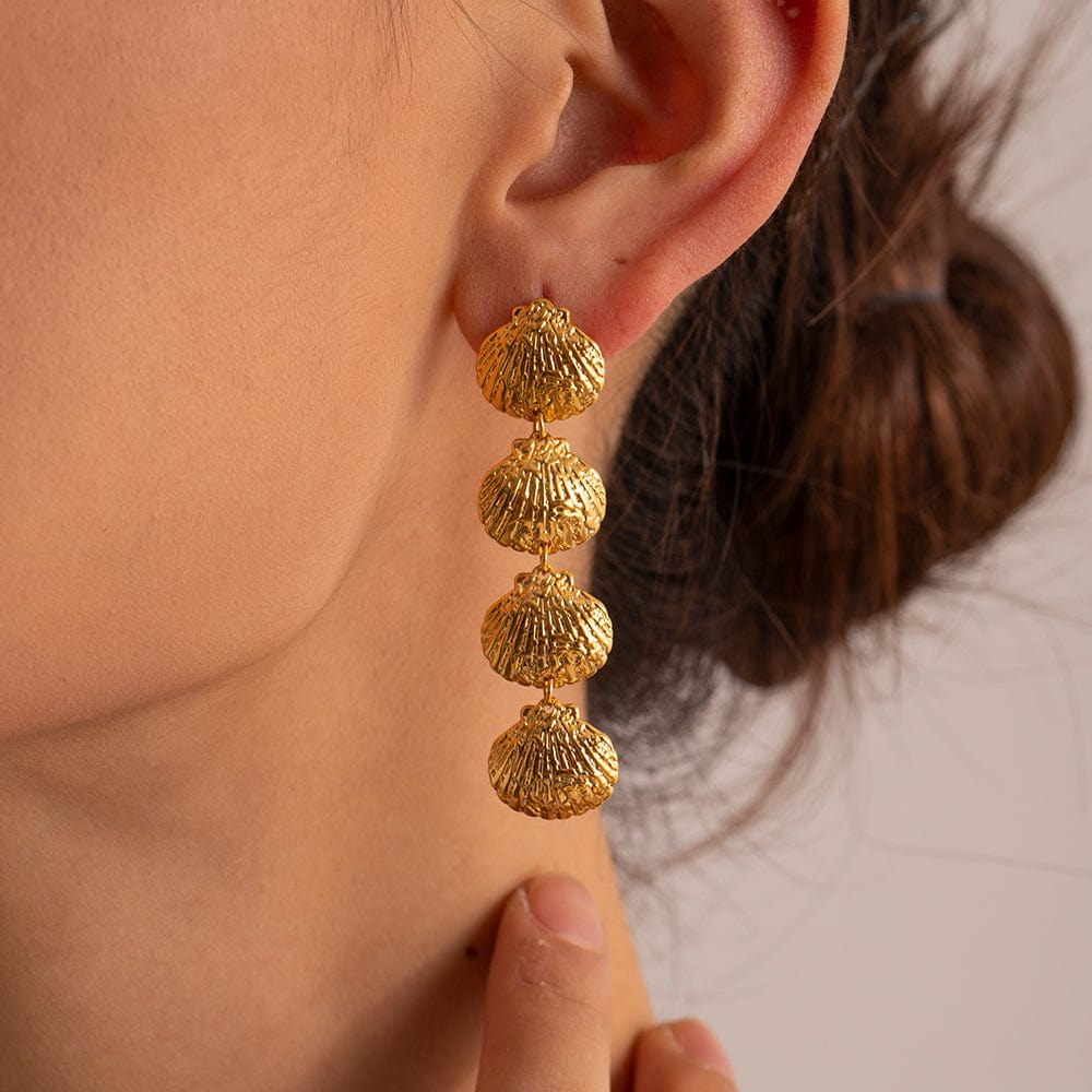 Luxurious Mi Amore gold jewelry, a timeless addition to your collection. Find the finest gold jewelry in Trinidad and TobagoELLIE- SEASHELLS DROP EARRINGS- GOLD